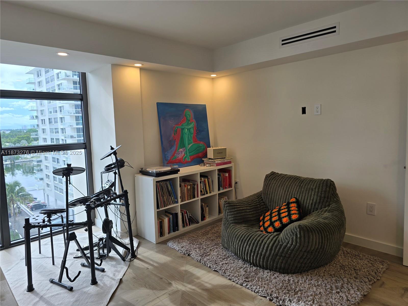 Millionaire's Row Miami Beach, FL 33140 - Photo 25 of 34 a living room with furniture and a flat screen tv