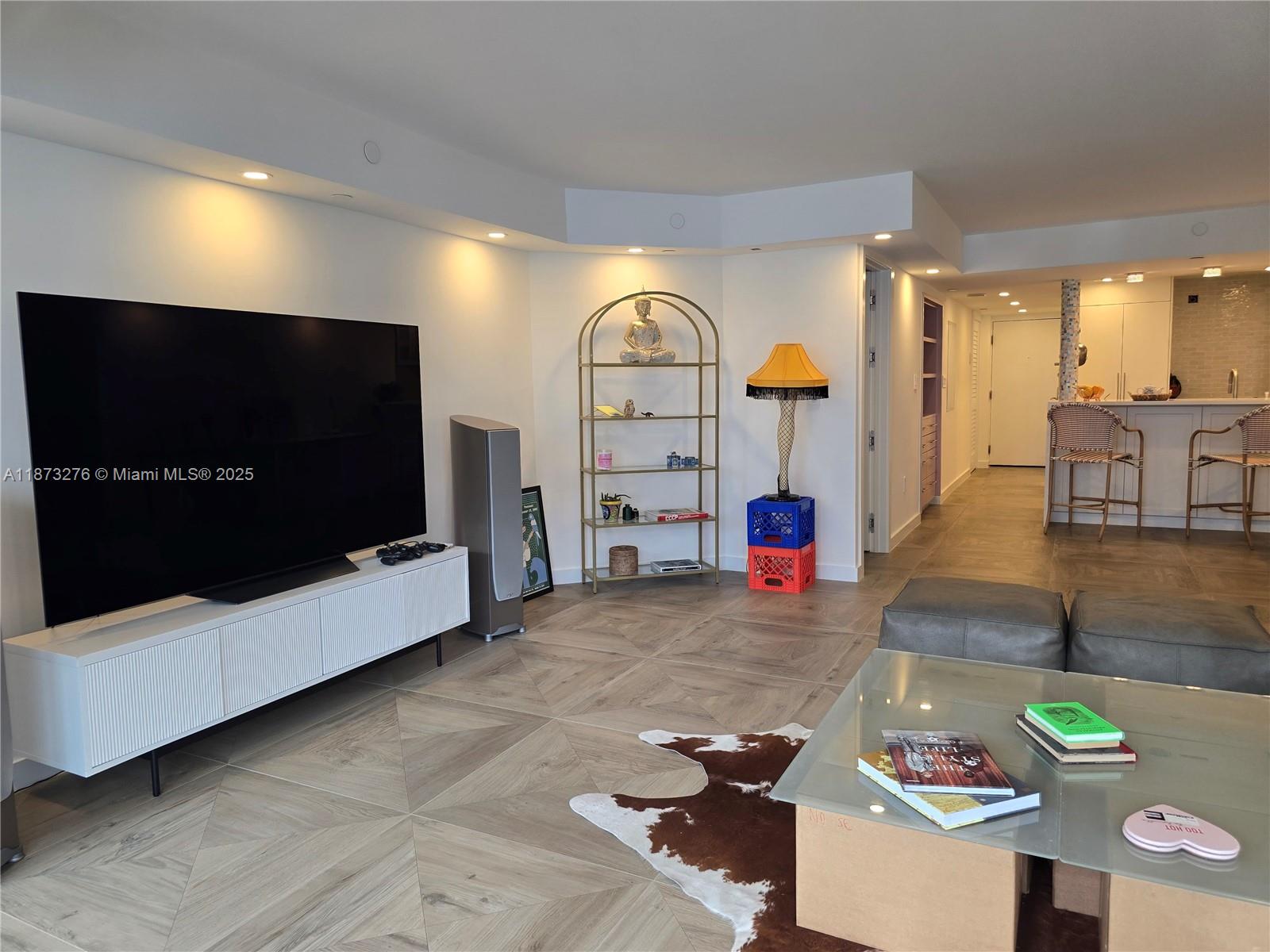 Millionaire's Row Miami Beach, FL 33140 - Photo 5 of 34 a living room with furniture and a flat screen tv