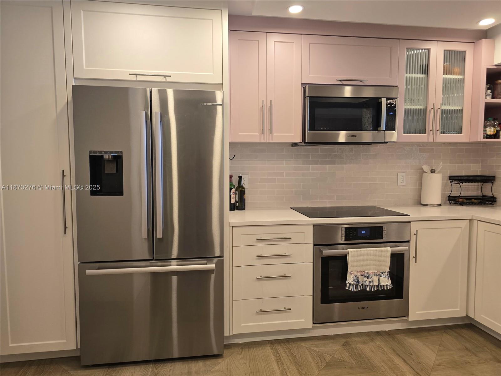 Millionaire's Row Miami Beach, FL 33140 - Photo 8 of 34 a kitchen with a refrigerator stove and microwave