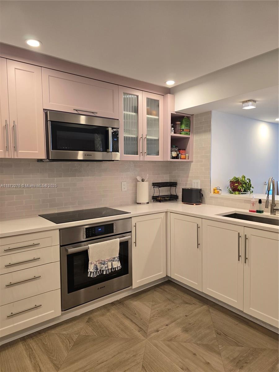 Millionaire's Row Miami Beach, FL 33140 - Photo 10 of 34 a kitchen with a stove and a microwave