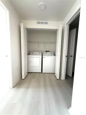 a view of a kitchen with a sink and dishwasher