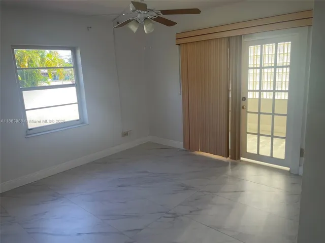 a kitchen with a refrigerator and a sink