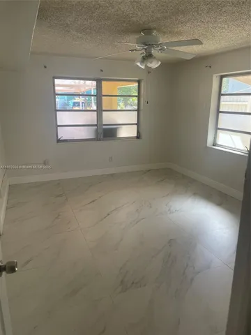 a view of a backyard of the house