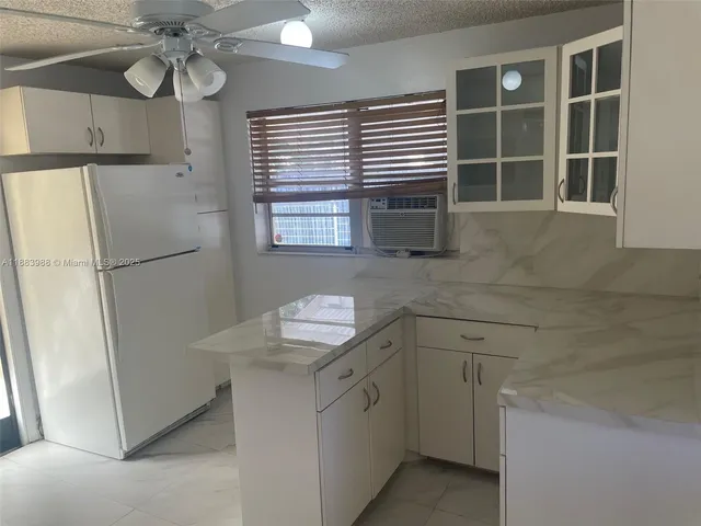 a view of a backyard with a patio