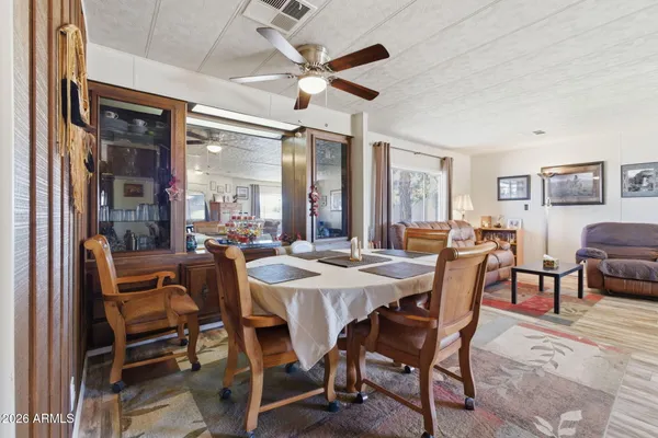 a kitchen with cabinets appliances a sink and a window