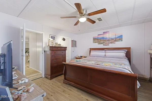 a view of walk in closet with clothes