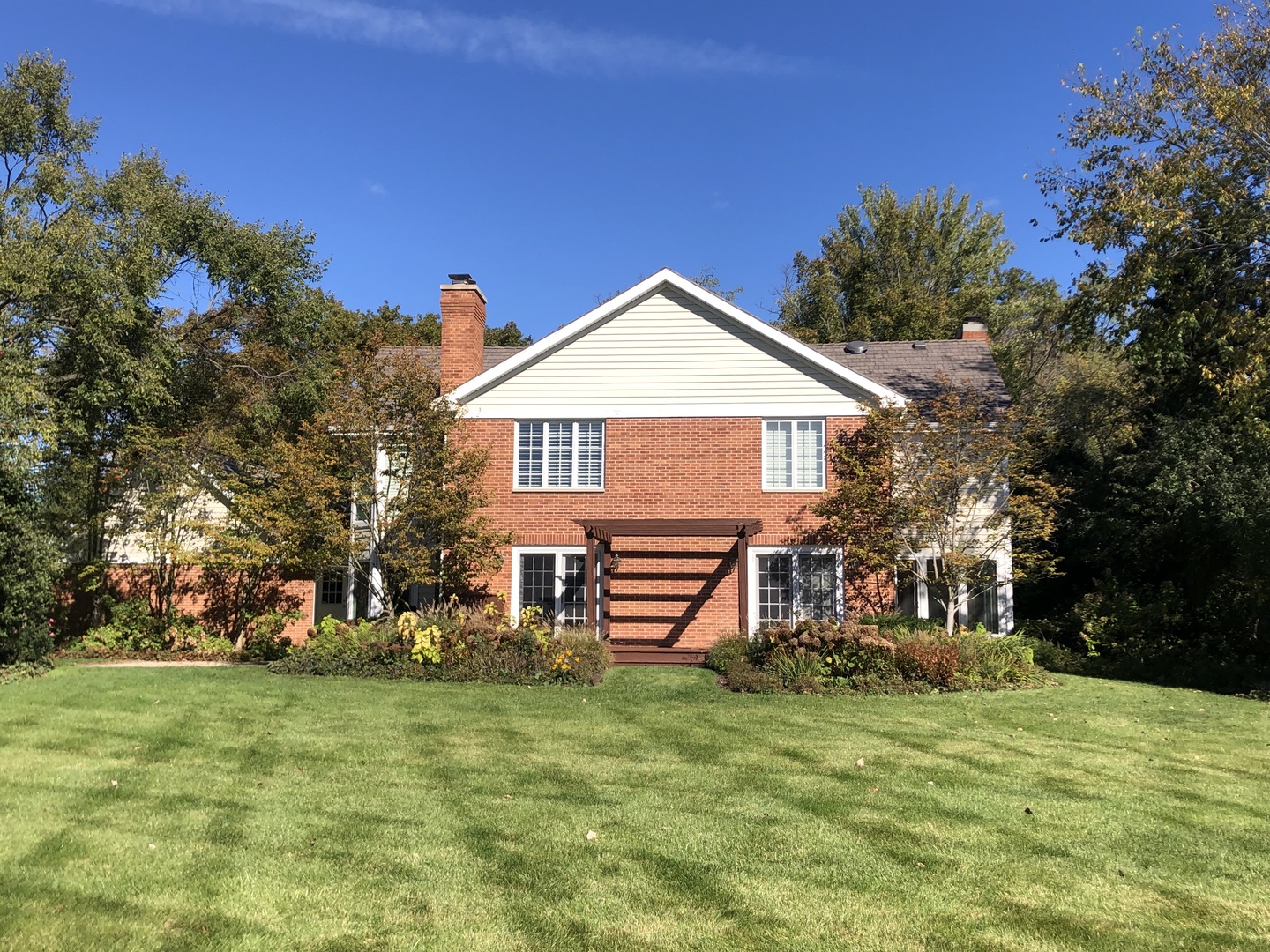 1021 Old Mill Road Lake Forest, IL 60045 - Photo 12 of 13 a front view of a house with a garden