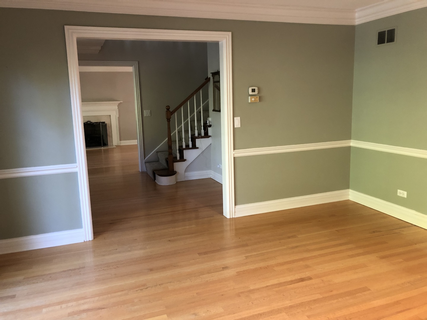 1021 Old Mill Road Lake Forest, IL 60045 - Photo 5 of 13 a view of a hallway with wooden floor and staircase