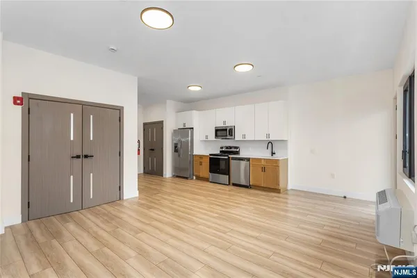 a view of kitchen with wooden floor