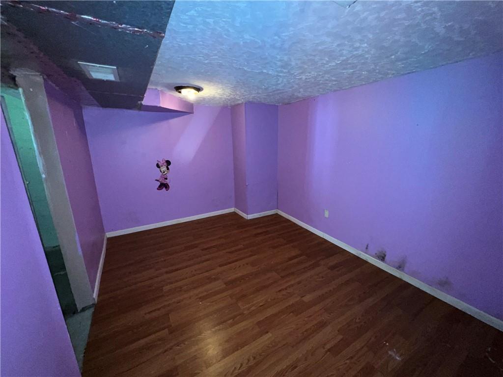 151 Oak Forest Road Brave, PA 15316 - Photo 14 of 16 a view of empty room with wooden floor