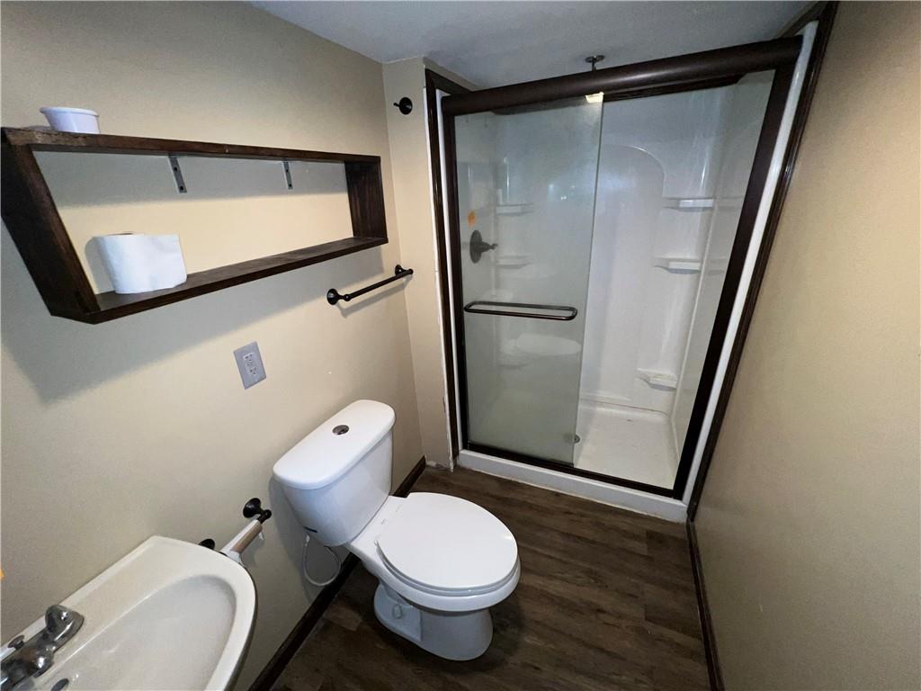 151 Oak Forest Road Brave, PA 15316 - Photo 3 of 16 a white toilet sitting next to a bathroom sink
