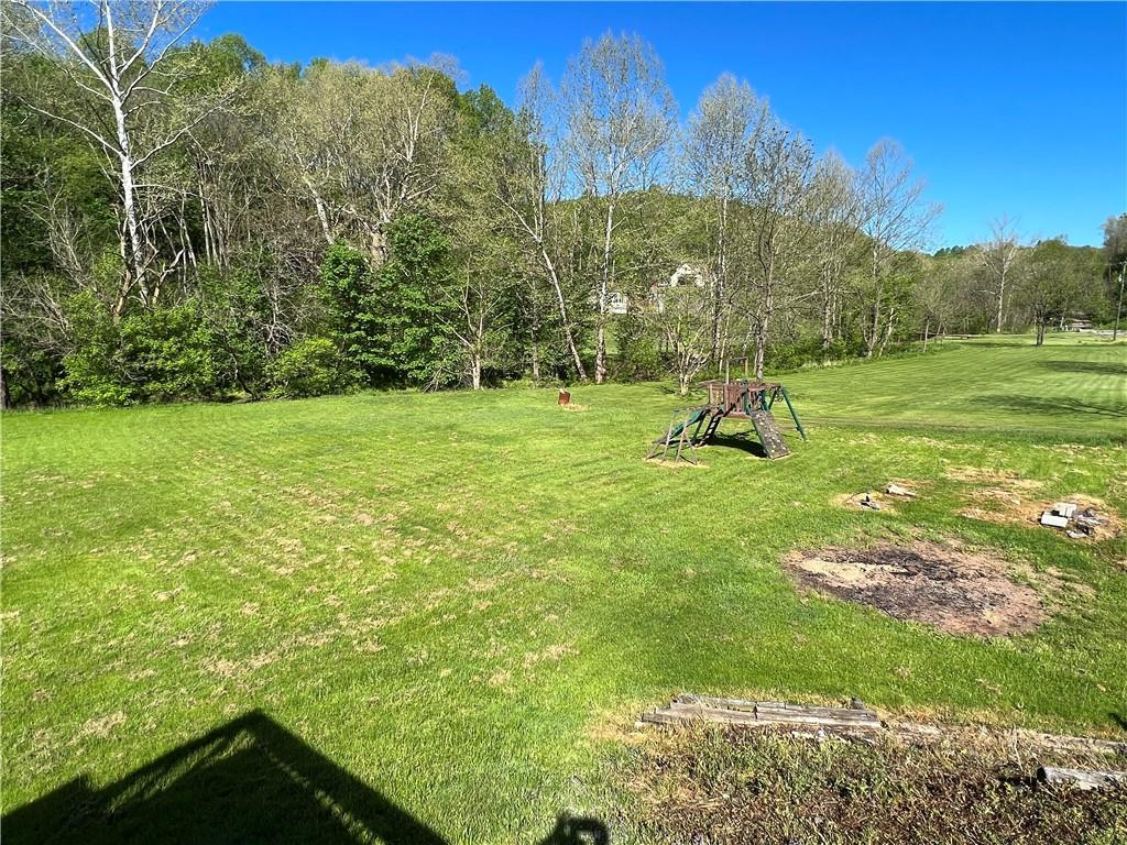 151 Oak Forest Road Brave, PA 15316 - Photo 4 of 16 a view of a field with a tree