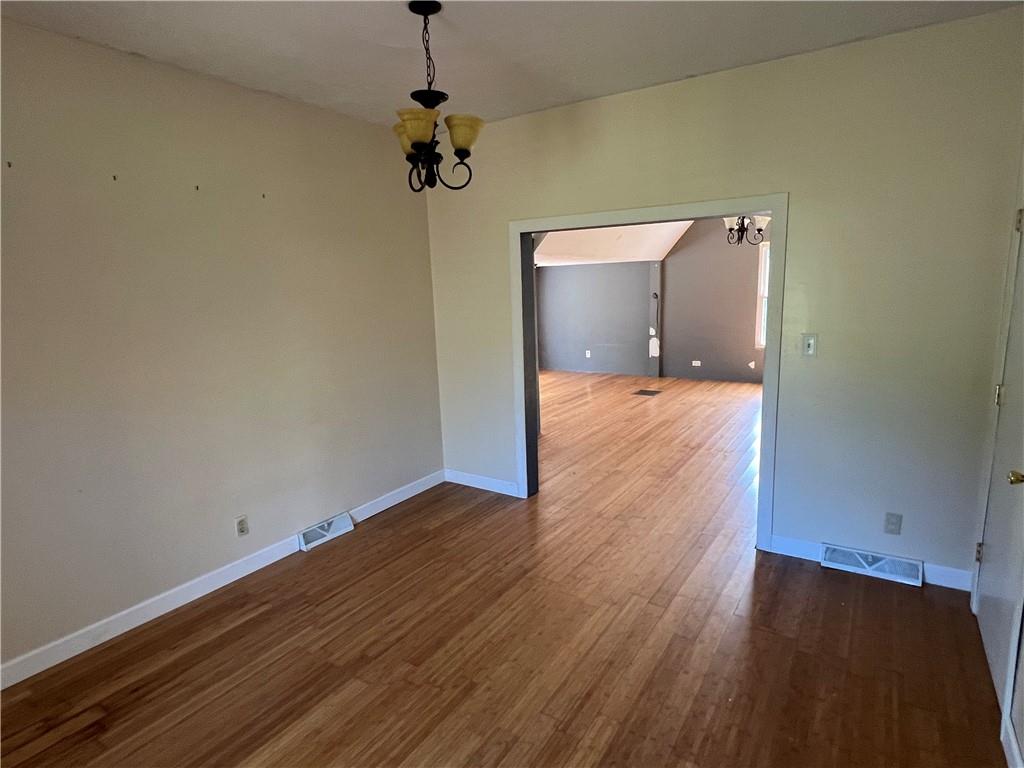 151 Oak Forest Road Brave, PA 15316 - Photo 8 of 16 a view of empty room with wooden floor