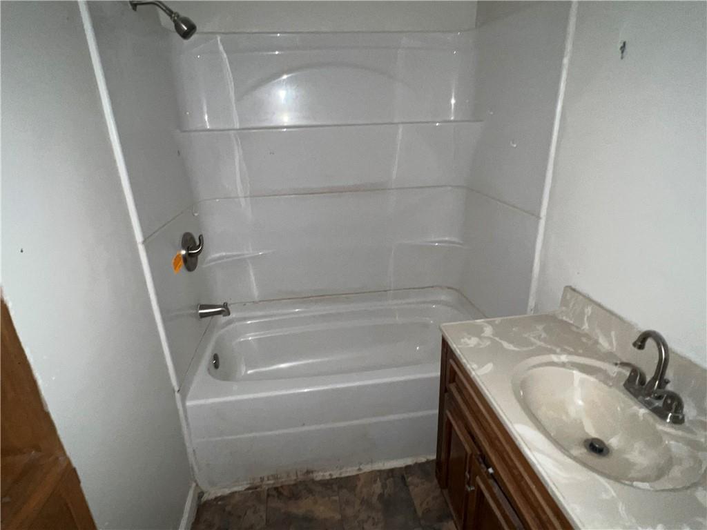 151 Oak Forest Road Brave, PA 15316 - Photo 9 of 16 a bathroom with a sink and tub