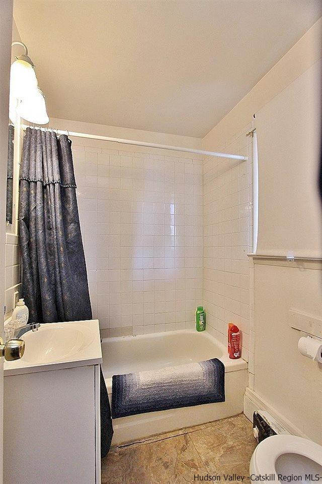 779 Neighborhood Road Lake Katrine, NY 12449 - Photo 11 of 26 a bathroom with a tub a sink and a toilet