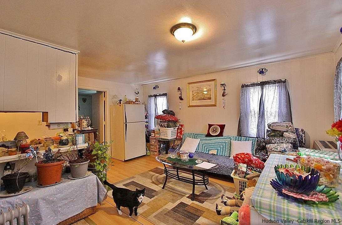 779 Neighborhood Road Lake Katrine, NY 12449 - Photo 15 of 26 a living room with furniture and a wooden floor