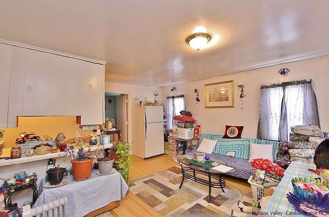 779 Neighborhood Road Lake Katrine, NY 12449 - Photo 18 of 26 a living room with furniture and a window