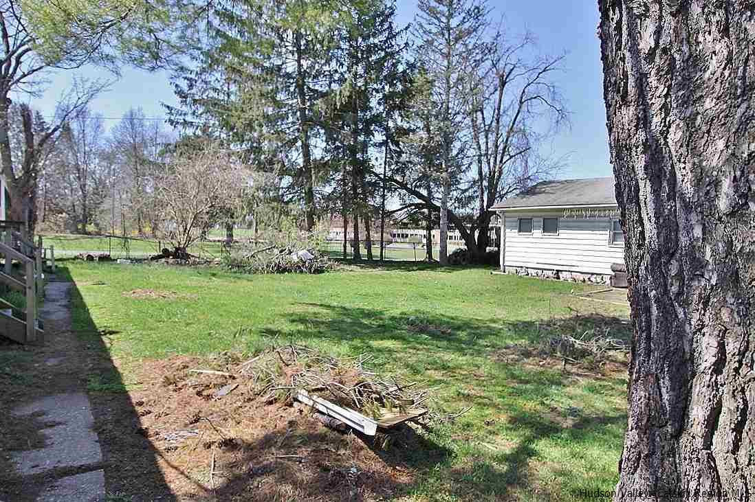 779 Neighborhood Road Lake Katrine, NY 12449 - Photo 20 of 26 a view of a yard with plants and large tree
