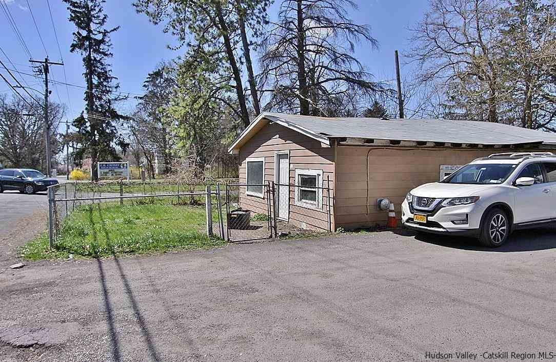 779 Neighborhood Road Lake Katrine, NY 12449 - Photo 23 of 26 a view of a house with a yard and garage
