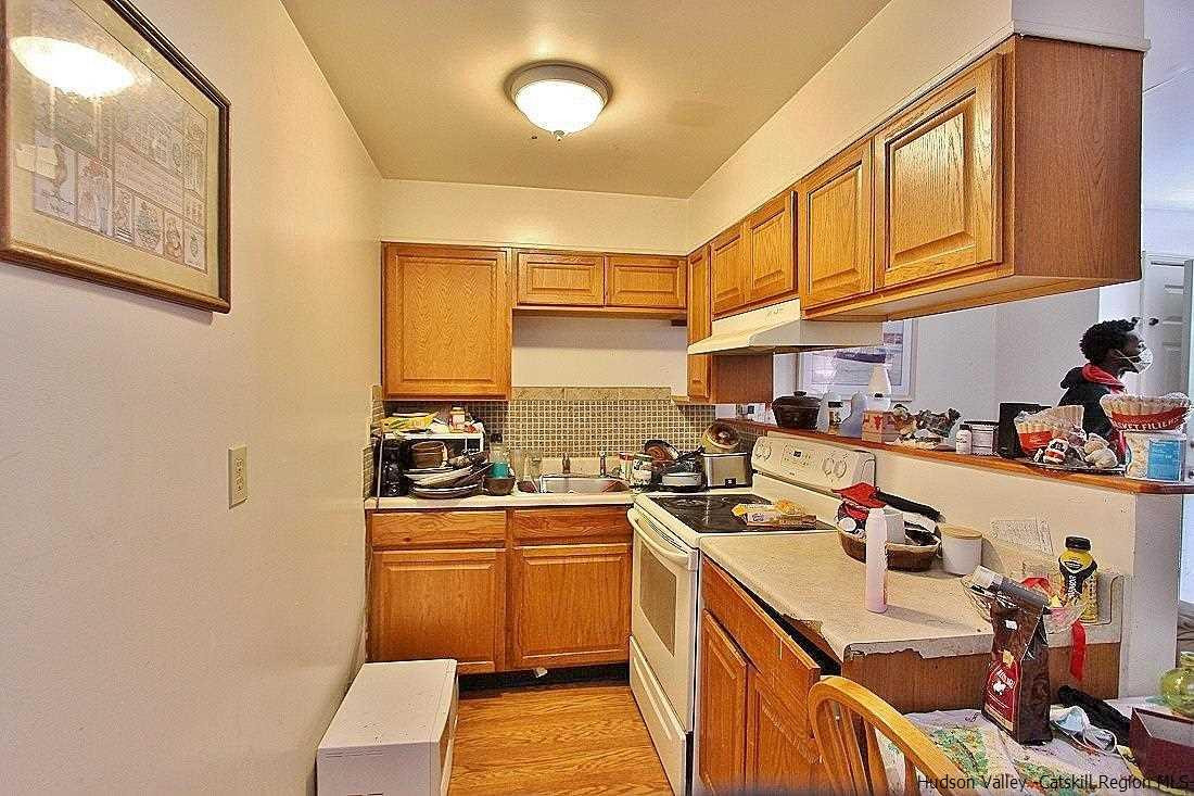 779 Neighborhood Road Lake Katrine, NY 12449 - Photo 7 of 26 a kitchen with stainless steel appliances granite countertop a sink stove and cabinets