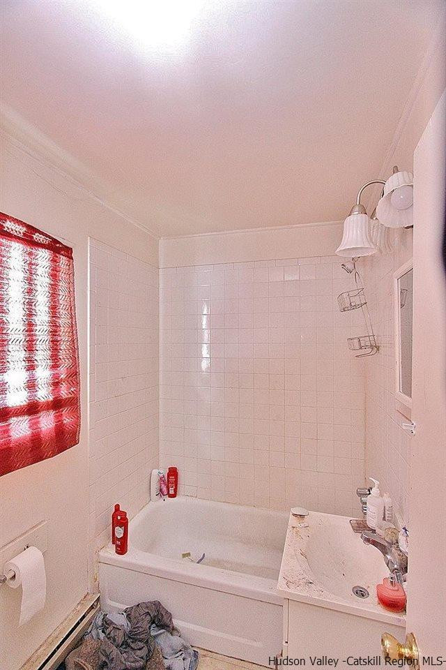 779 Neighborhood Road Lake Katrine, NY 12449 - Photo 9 of 26 a bathroom with a tub sink and a window