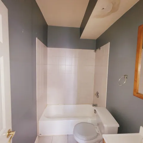 an empty room with a empty space and windows