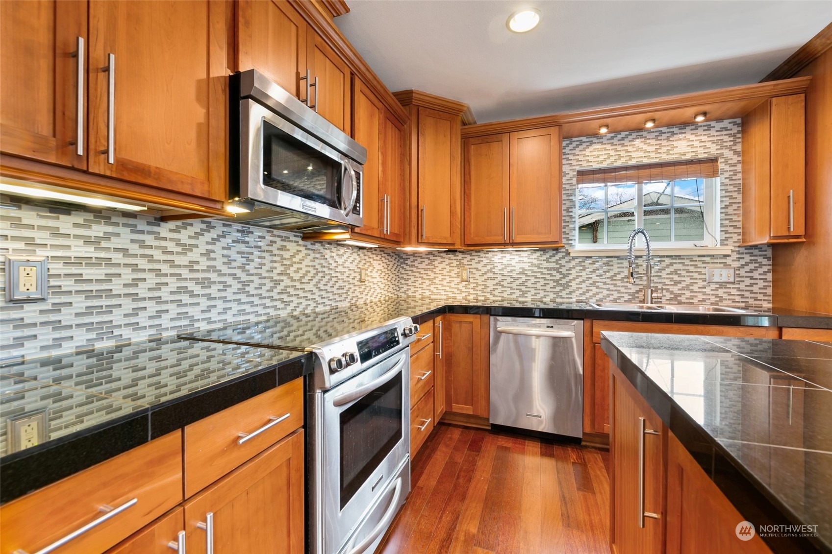 708 North 5th Street Renton, WA 98057 - Photo 7 of 29 a kitchen with stainless steel appliances granite countertop a stove sink and microwave