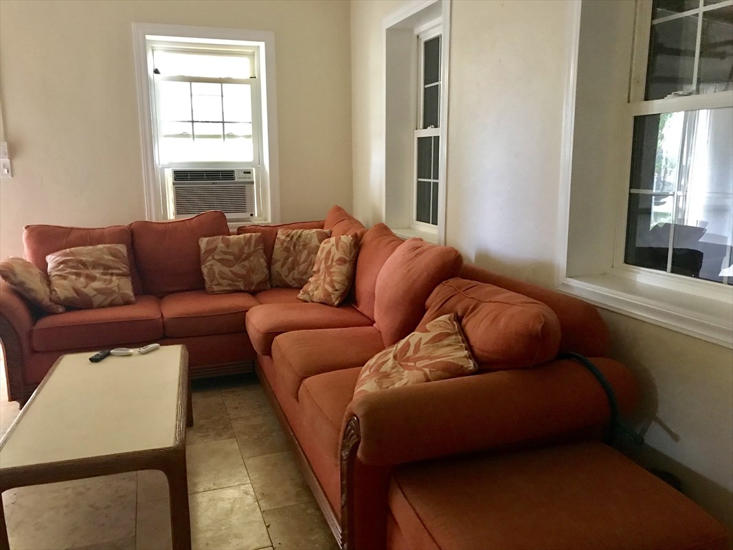 8535 Elepaio Road Kekaha, HI 96752 - Photo 2 of 2 a living room with furniture and a window