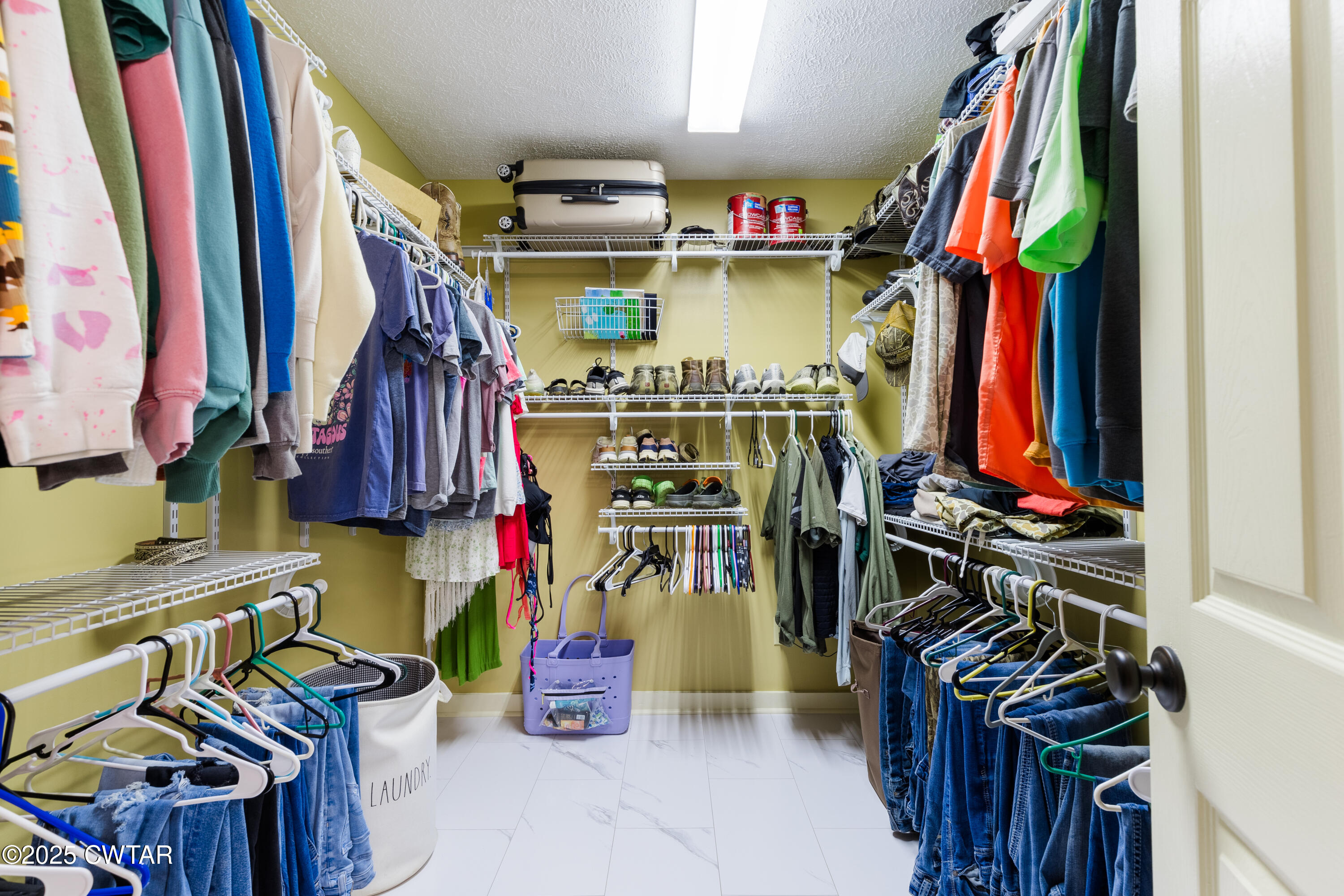 47 Peace Chapel Road Scotts Hill, TN 38374 - Photo 15 of 28 a view of walk in closet with clothes