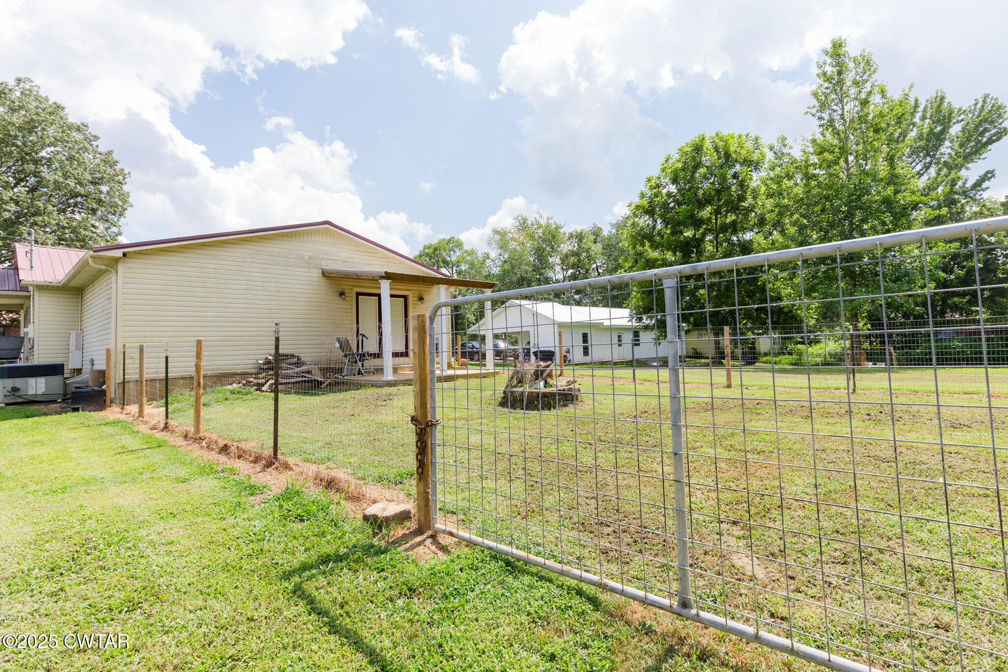 47 Peace Chapel Road Scotts Hill, TN 38374 - Photo 24 of 28 a view of a house with backyard