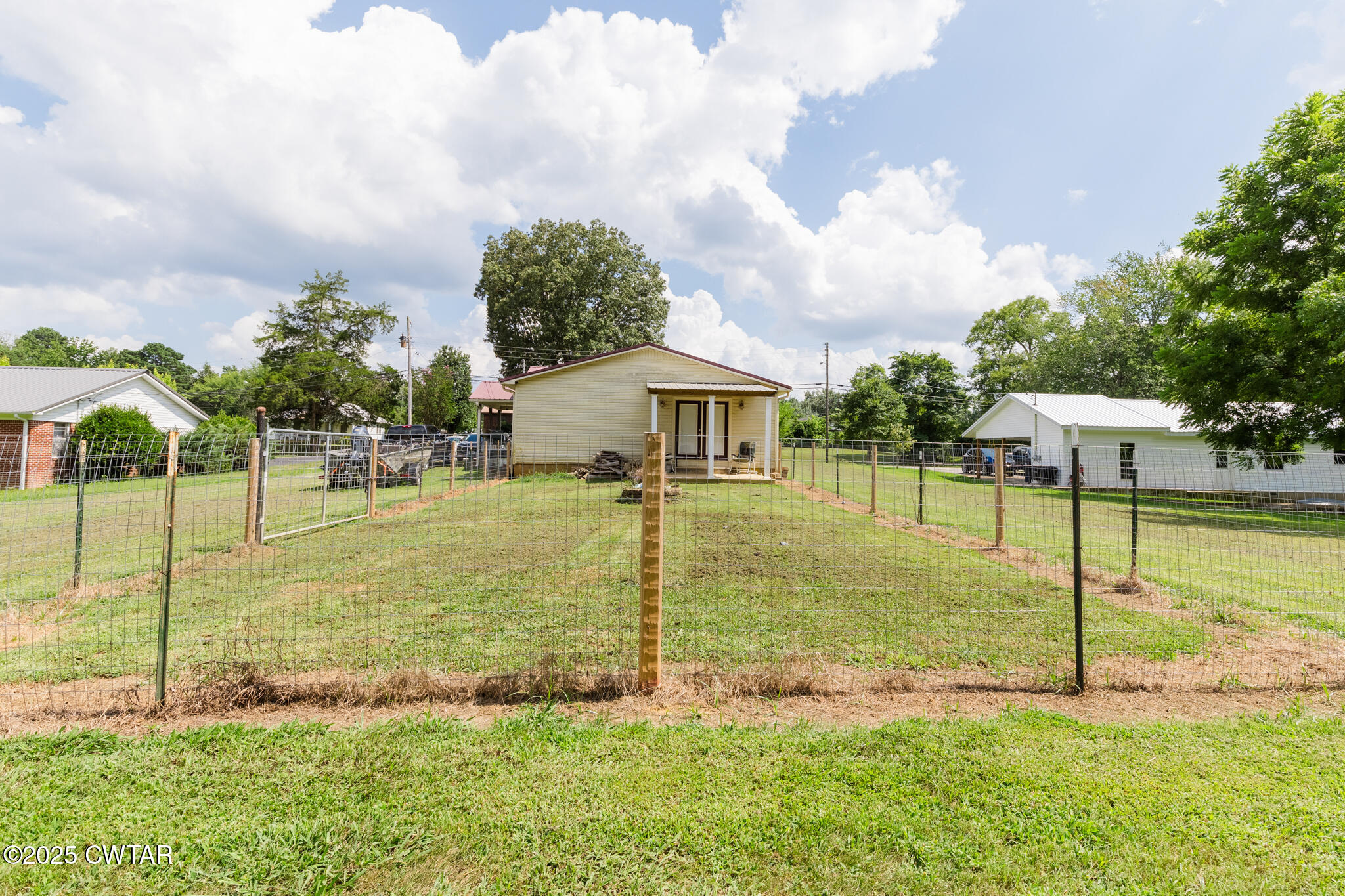 47 Peace Chapel Road Scotts Hill, TN 38374 - Photo 25 of 28 a view of a house with backyard and porch