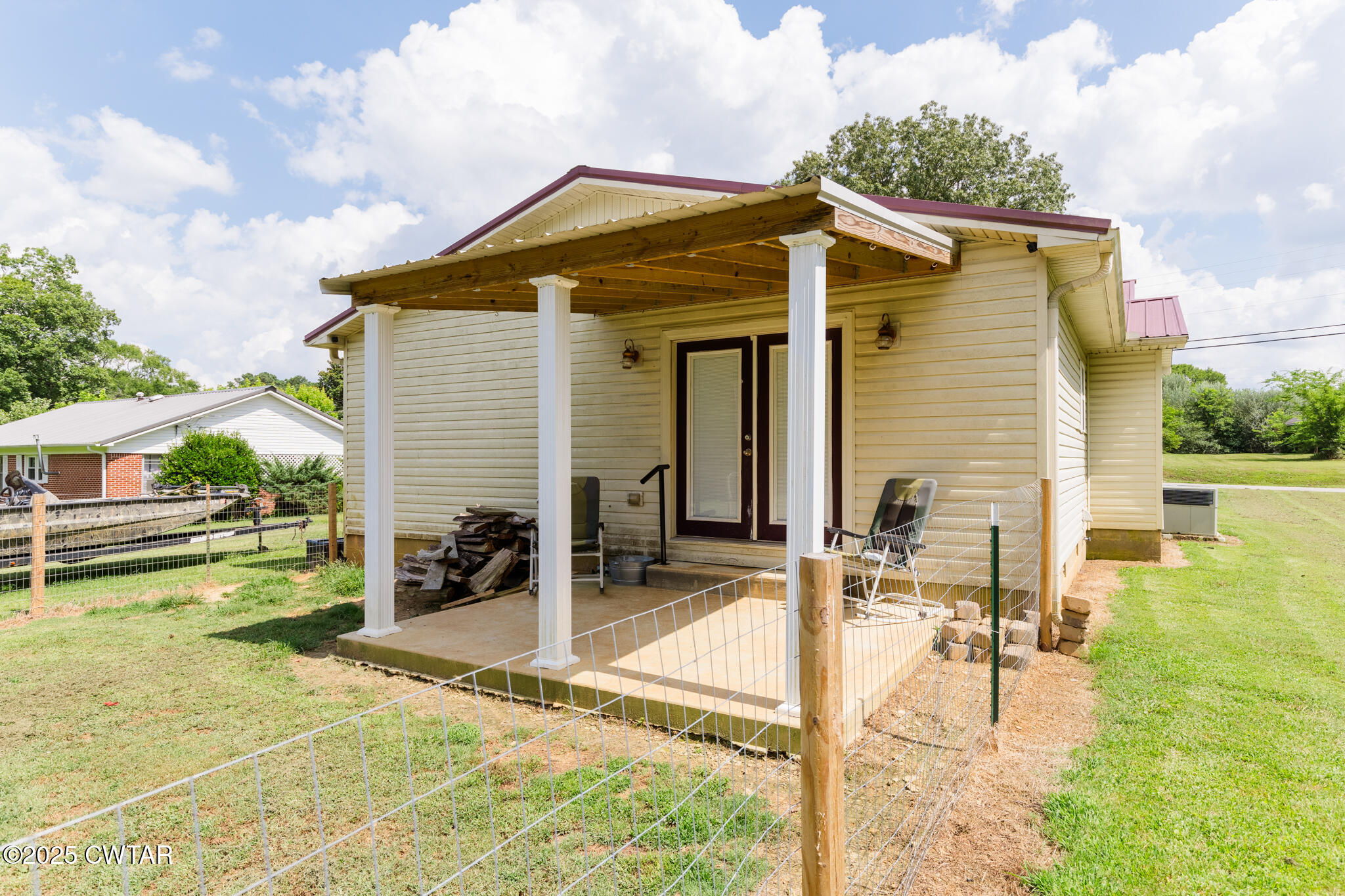 47 Peace Chapel Road Scotts Hill, TN 38374 - Photo 27 of 28 a view of a house with backyard and sitting area