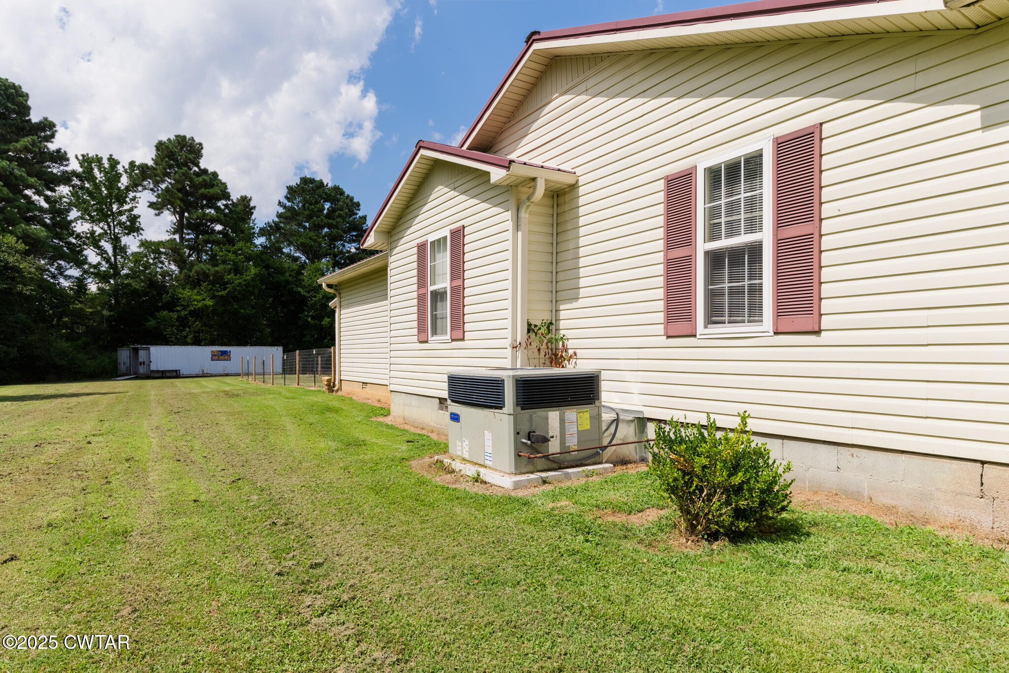 47 Peace Chapel Road Scotts Hill, TN 38374 - Photo 28 of 28 a view of a house with backyard and sitting area