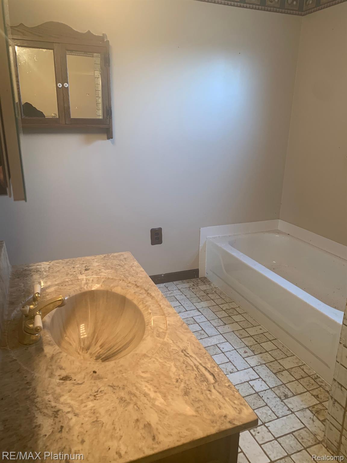 3850 Jewell Road Howell, MI 48843 - Photo 55 of 60 Tile floor with a tub.