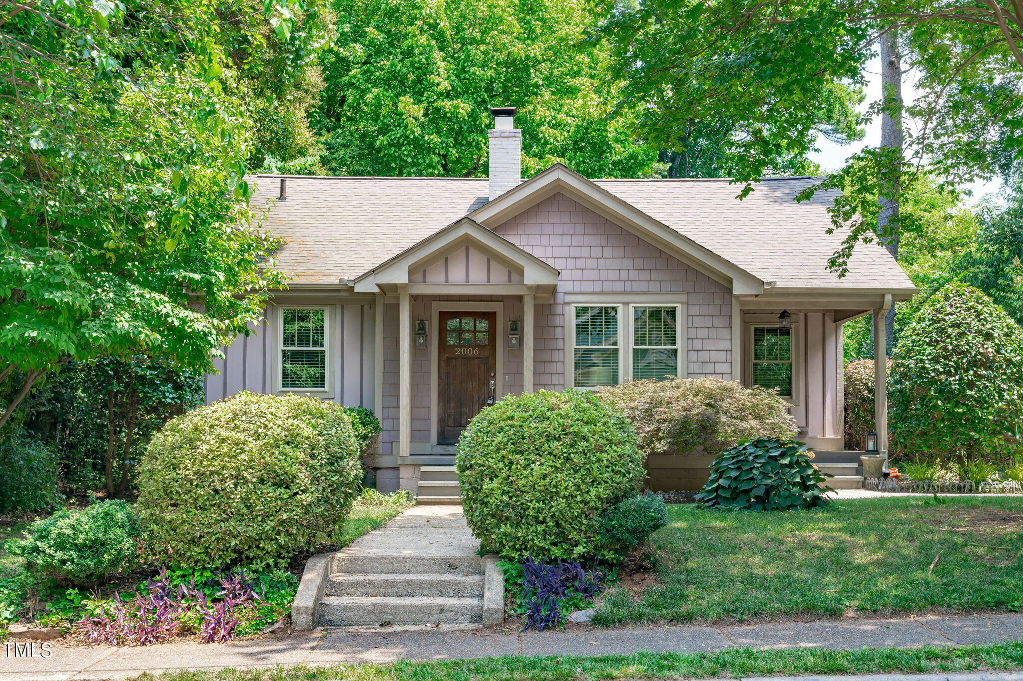 2006 McCarthy Street Raleigh, NC 27608 - Photo 1 of 40 a front view of a house with a yard
