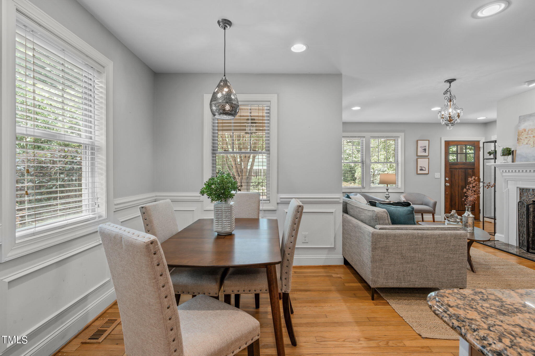 2006 McCarthy Street Raleigh, NC 27608 - Photo 12 of 40 a living room with furniture and a chandelier