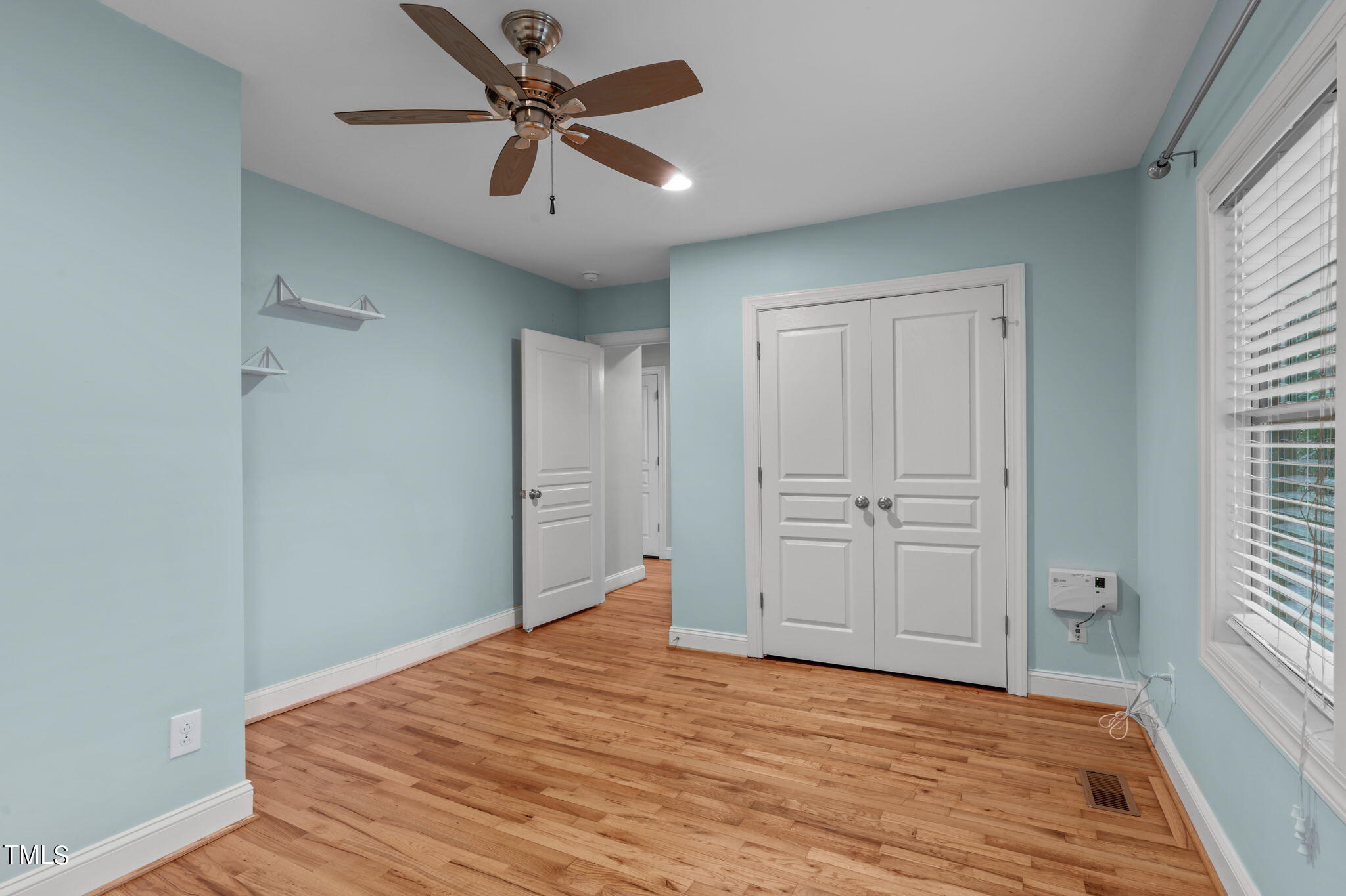 2006 McCarthy Street Raleigh, NC 27608 - Photo 30 of 40 a view of empty room with wooden floor and fan