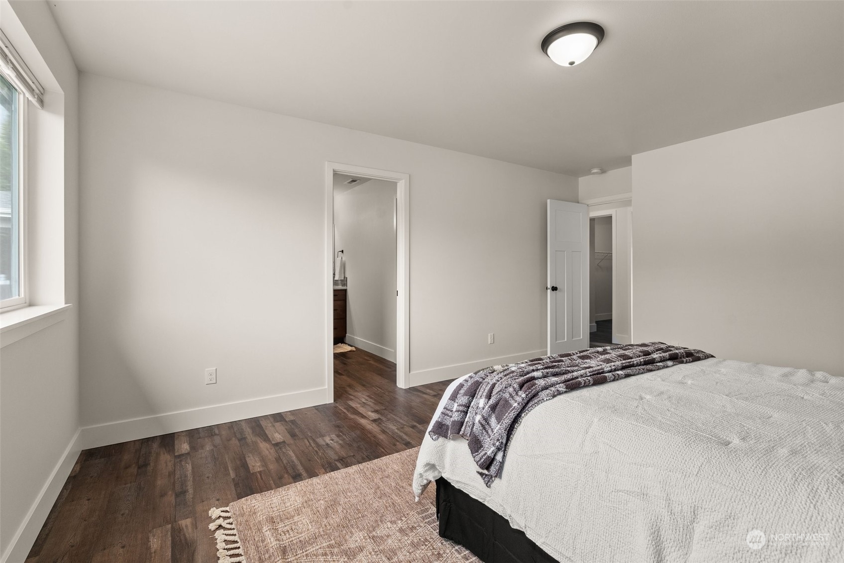 379-14 Collins Road Toledo, WA 98591 - Photo 14 of 30 a bedroom with a bed and wooden floor