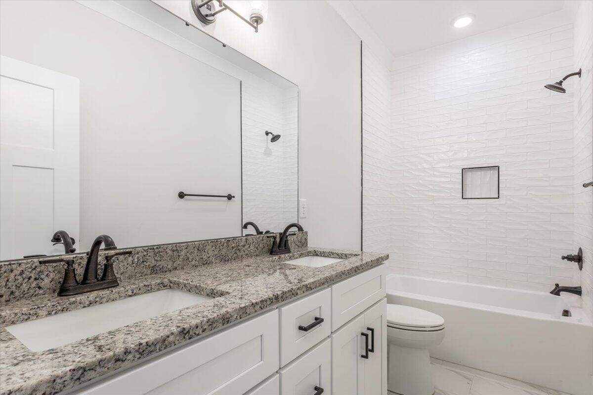 7391 Gamble Road Georgetown, TN 37336 - Photo 16 of 27 a bathroom with a granite countertop sink and a mirror