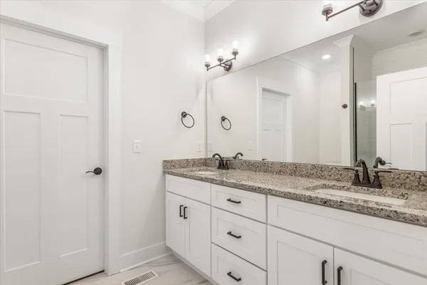 a a bathroom with a toilet and a shower