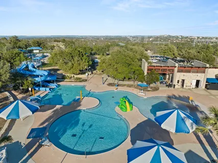 a view of a small house with a yard