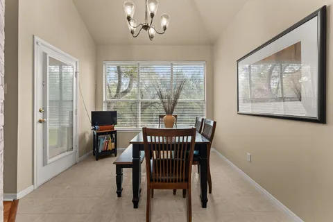 a view of a dining room with furniture window and outside view