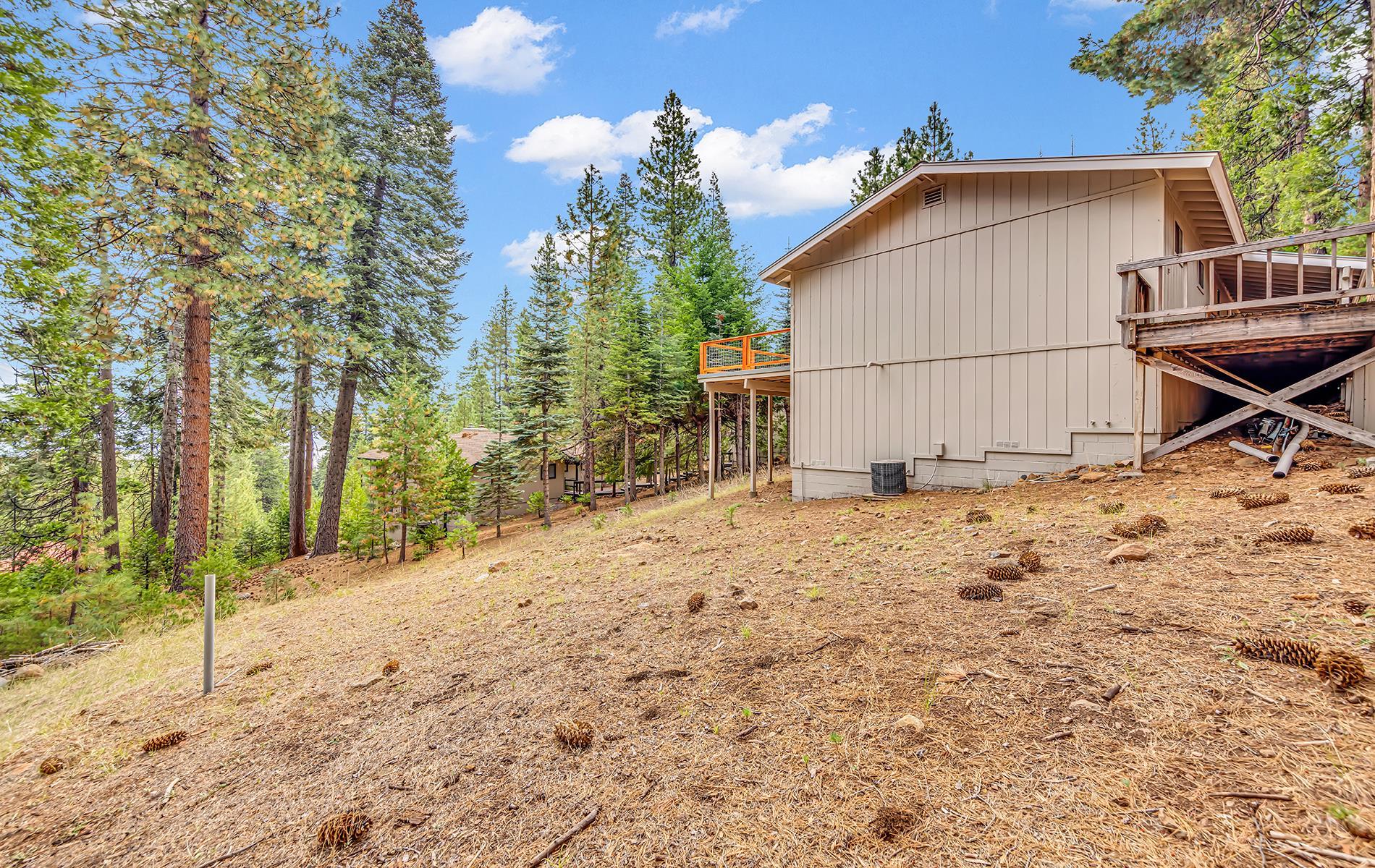 608 East Burnt Cedar Road Lake Almanor, CA 96137 - Photo 31 of 36 a backyard of a house with lots of green space