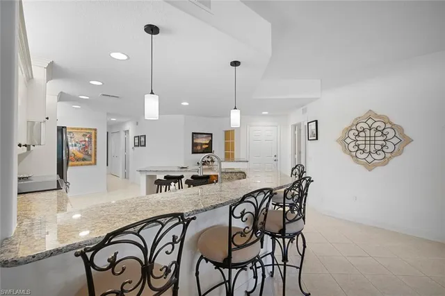 a kitchen with a sink and a refrigerator
