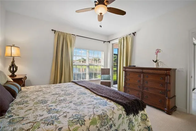 a spacious en suite bathroom with a double vanity sink and a mirror