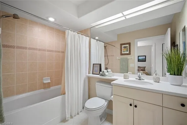 a front view of multiple houses with yard