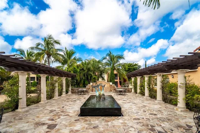 a view of a swimming pool and lounge chair