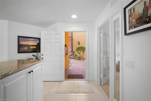 a large kitchen with a table and chairs in it