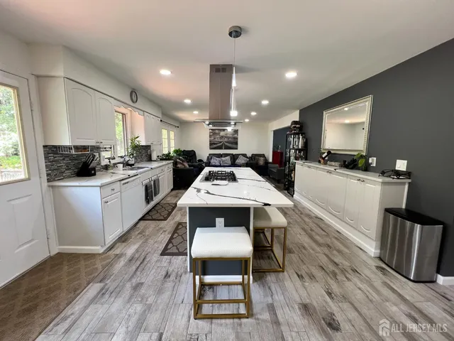 a kitchen with sink a counter space and appliances