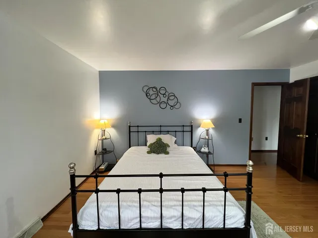 a view of a dining room with a table and chairs